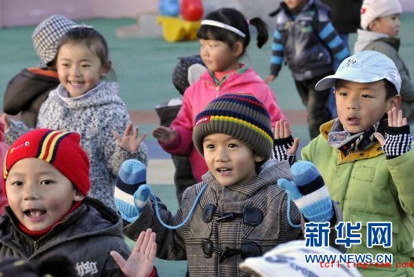 Children do exercises to radio music in a kindergarten in Lhasa City on November 24, 2010. 